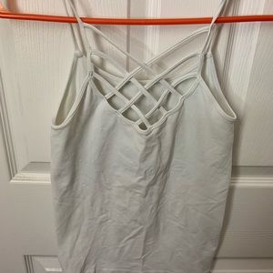 One size undershirt w/ criss cross detail in front. Super cute and super comfy!